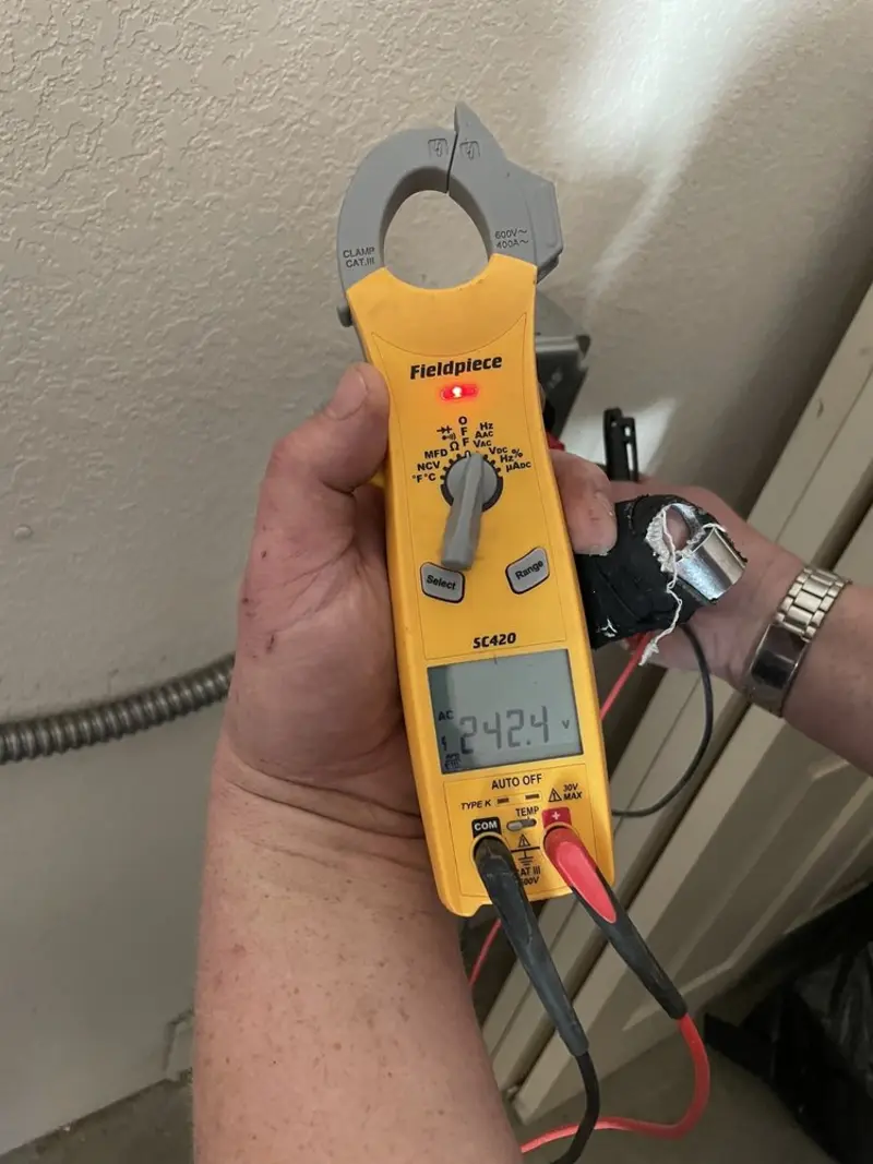 Voltage testing with clamp meter during Electrical Installation Services in Lafayette